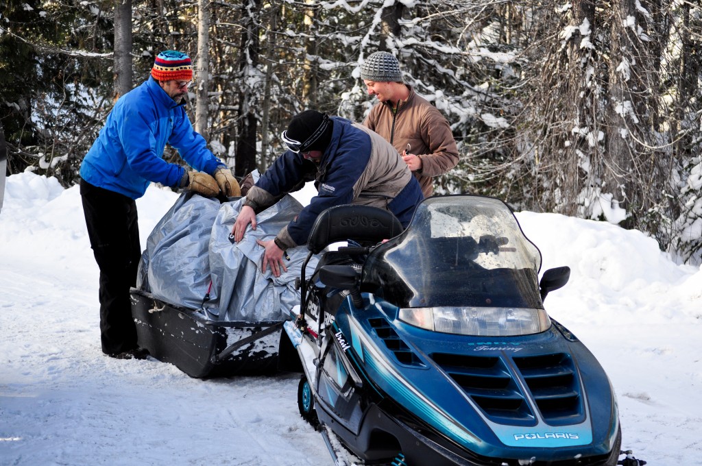 Loading up the snowmobiles for the 20 minute ride to the high camp