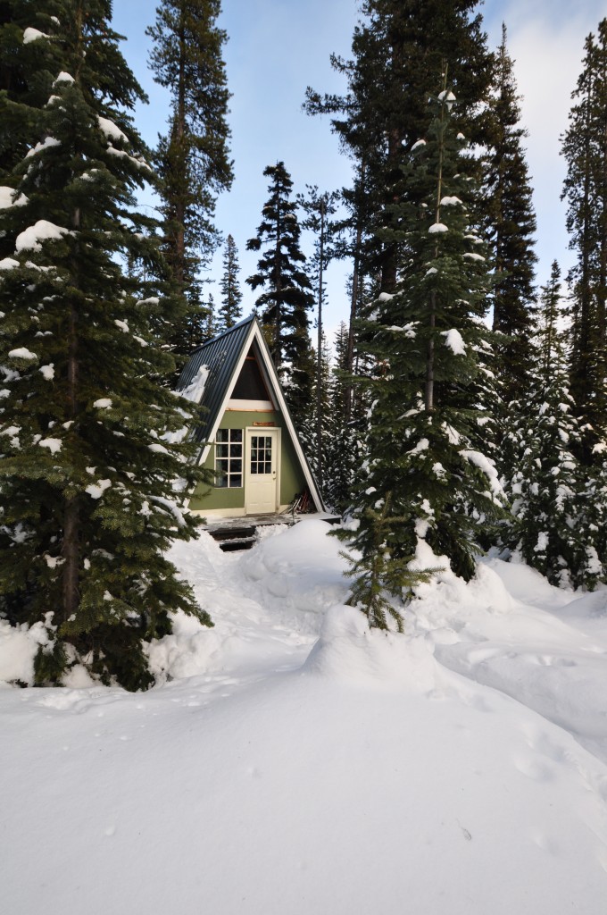 Cabins are typically single room A-frames where guests cook for themselves, keep warm with a wood stove and read by the light of oil lamps