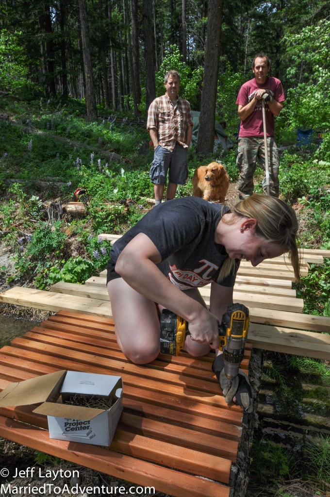 One worker, two supervisors.  Camille takes a turn with the cordless drill.