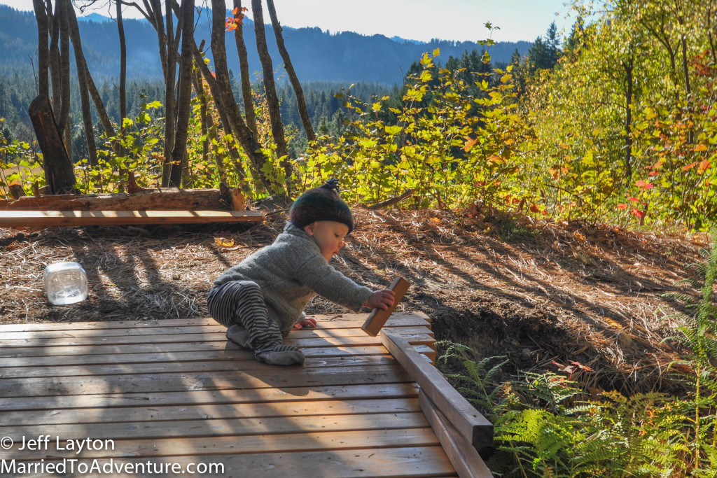 Ian helps to put the finishing touches on dad's bridge